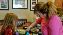 Mary and Lilly coloring eggs